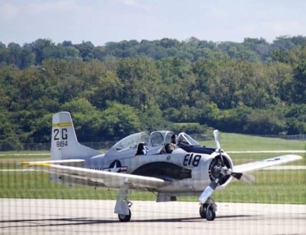 Lunken Airport runway with open cockpit and propeller plane