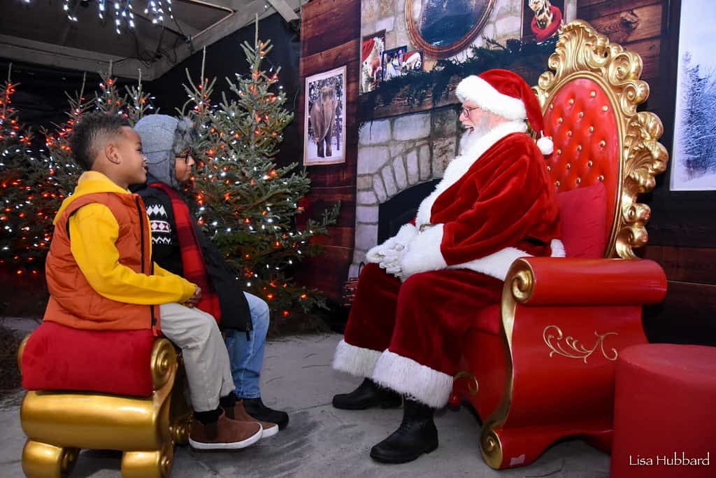 Santa with children at the Cincinati Zoo's Festival of Lights