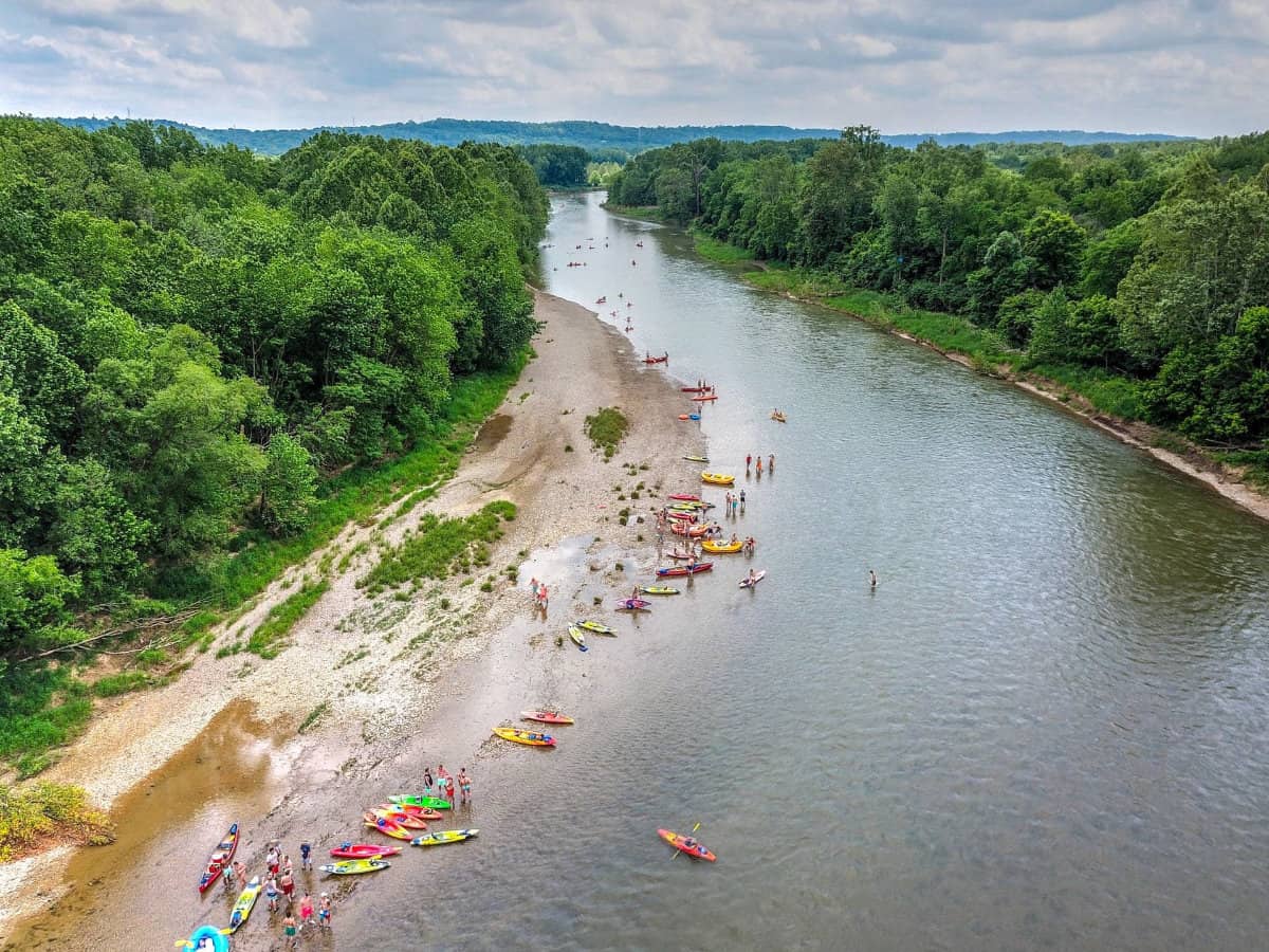 people stopping on the river's edge with Green Acres Kayak