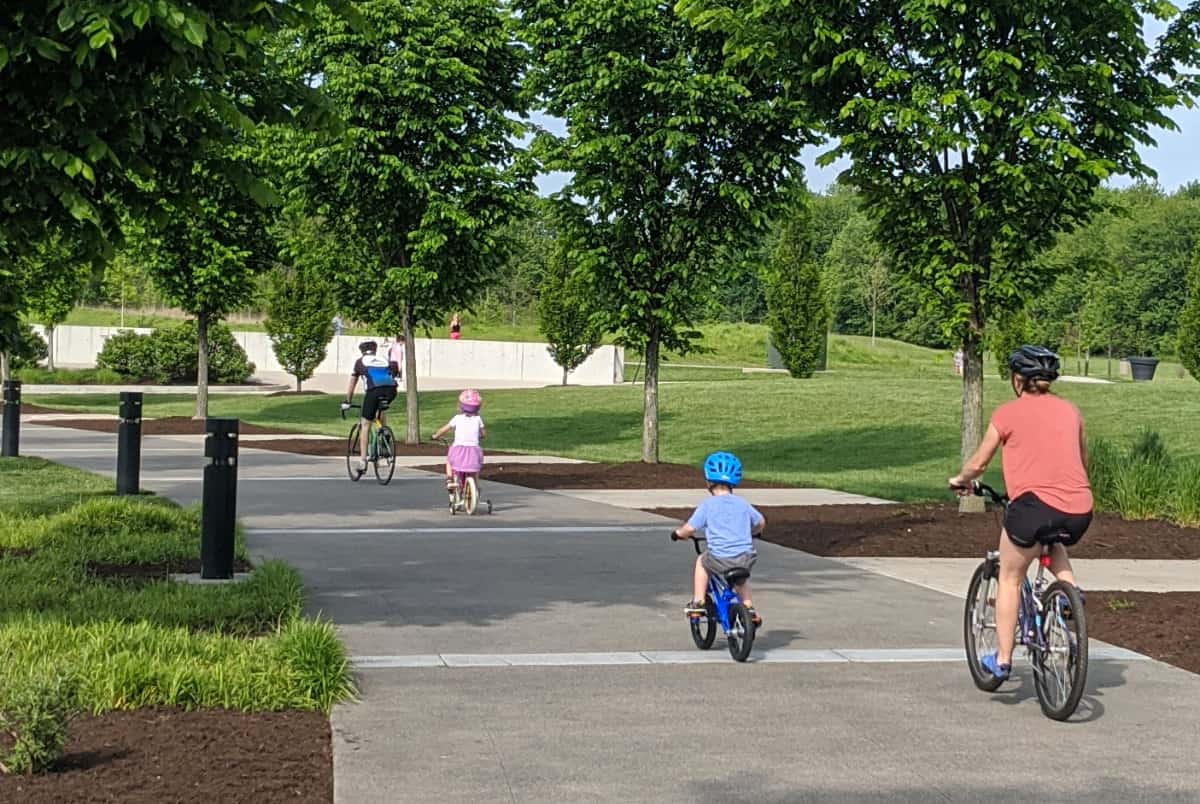 family biking on the trail at Summit Park