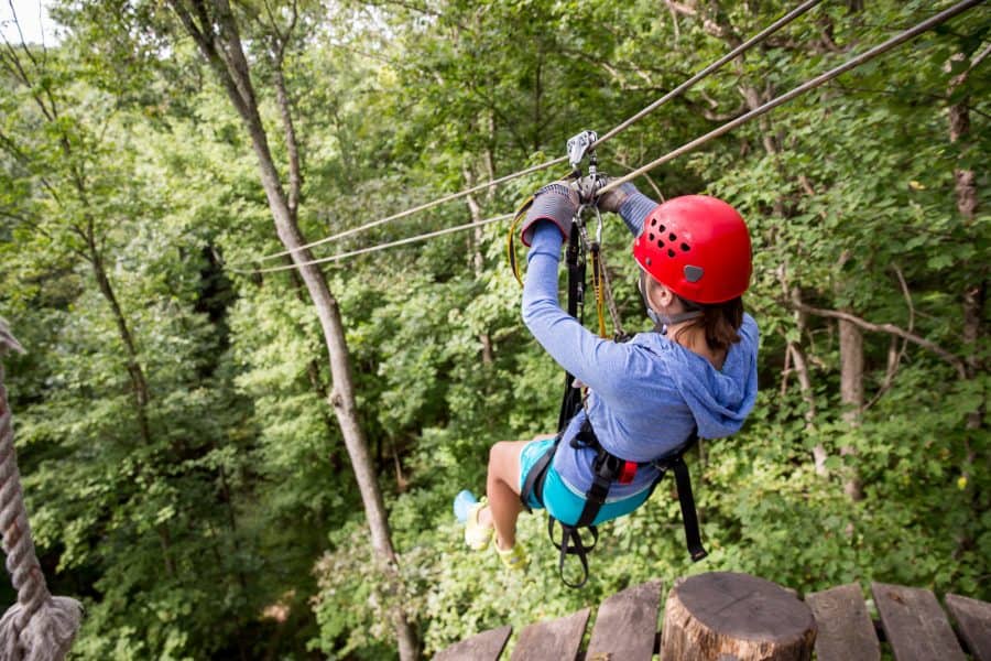 Young woman on a zip line with Tree Frog Canopy Tours