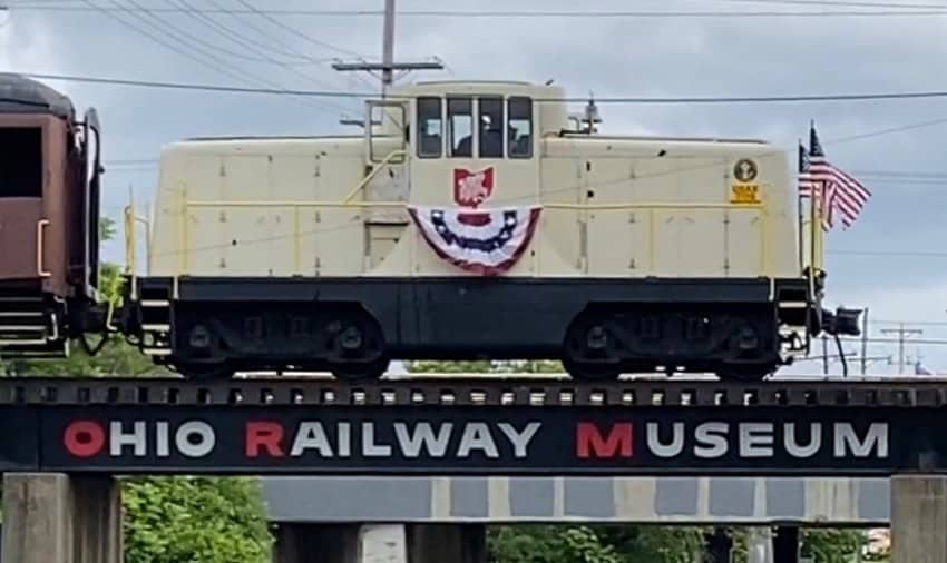 an Ohio Railway Museum train car on bridge
