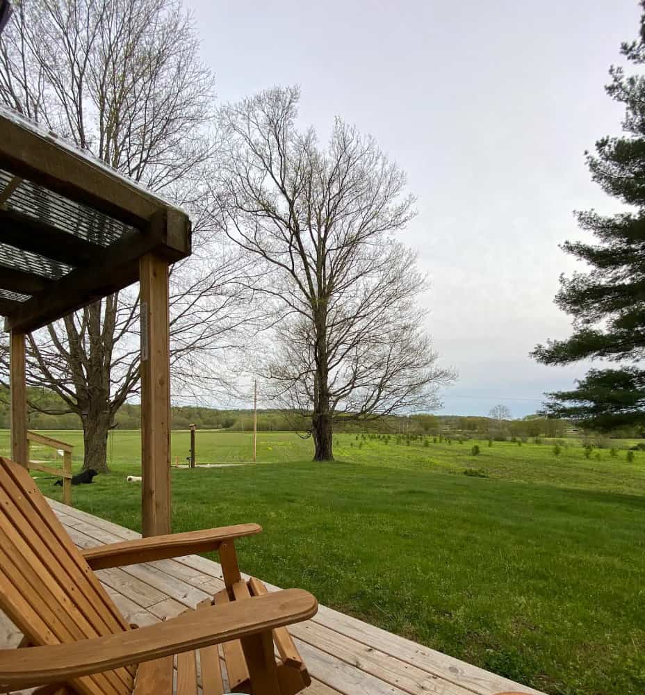 the deck from a cabin in Ohio overlooking a farm