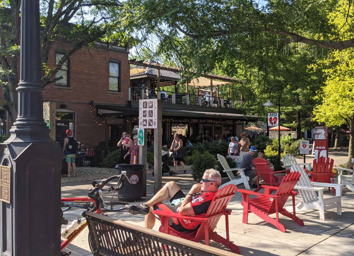 people lounging in chairs in downtown Loveland, Ohio