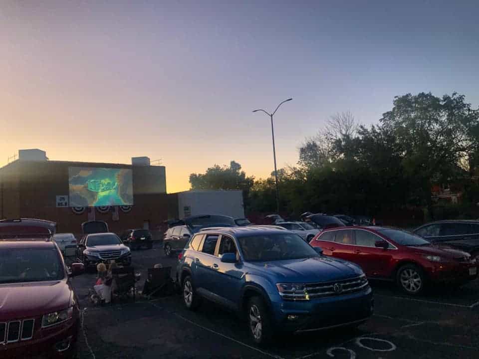Cars parked in the lot for a movie at the Hollywood Drive In Theatre 
