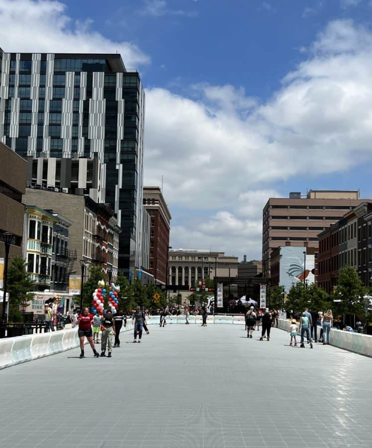 people roller skating at the outdoor rink on Court Street