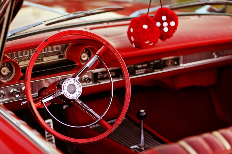 interior of a red car at at a classic car show