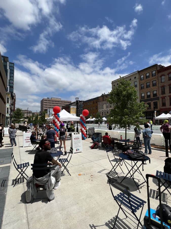 seating options along the sidewalk at the outdoor roller skating rink on Court Street Plaza downtown