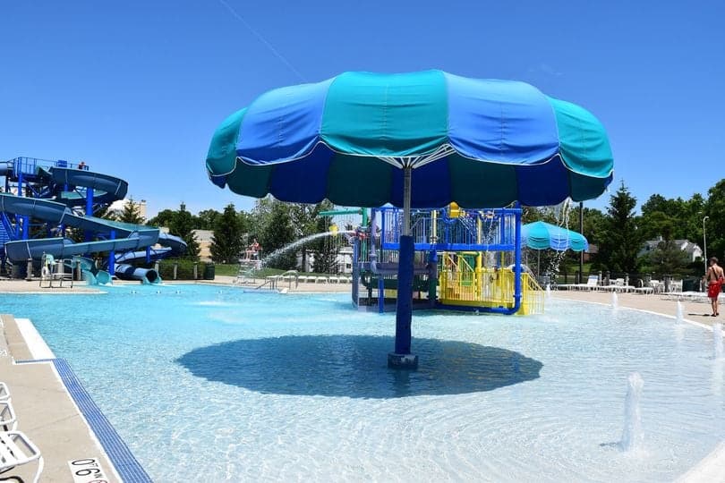 A small pool with large umbrella at Troy Aquatic Park