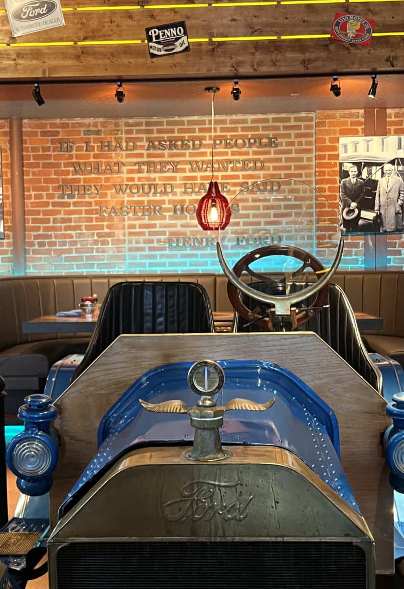 a vintage Ford parked in the middle of the restaurant at Ford's Garage Cincinnati
