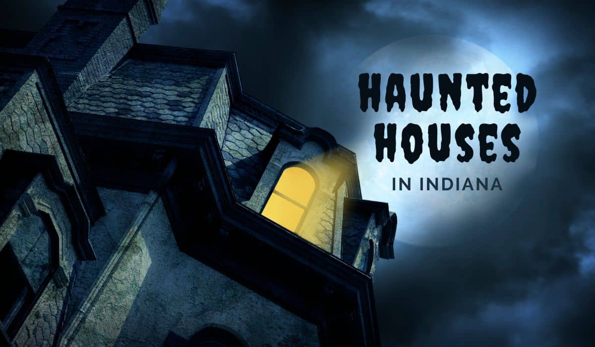 haunted house at night with a window glowing yellow