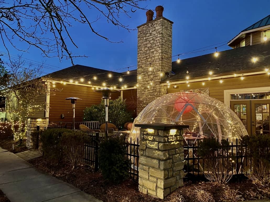 the patio at deSha's featuring their outdoor dining in an igloo
