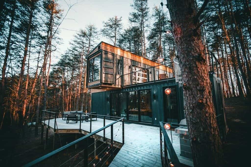 a shipping container cabin in the woods