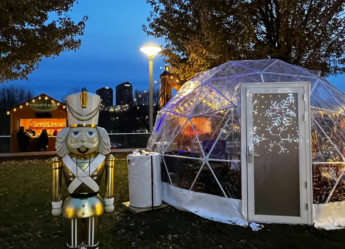 A toy soldier and an outdoor igloo on the lawn at Cincinnati Christkindlmarkt
