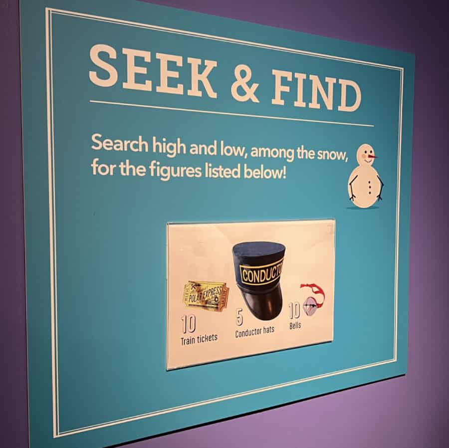 a sign displaying a Seek and Find game at Holiday Junction