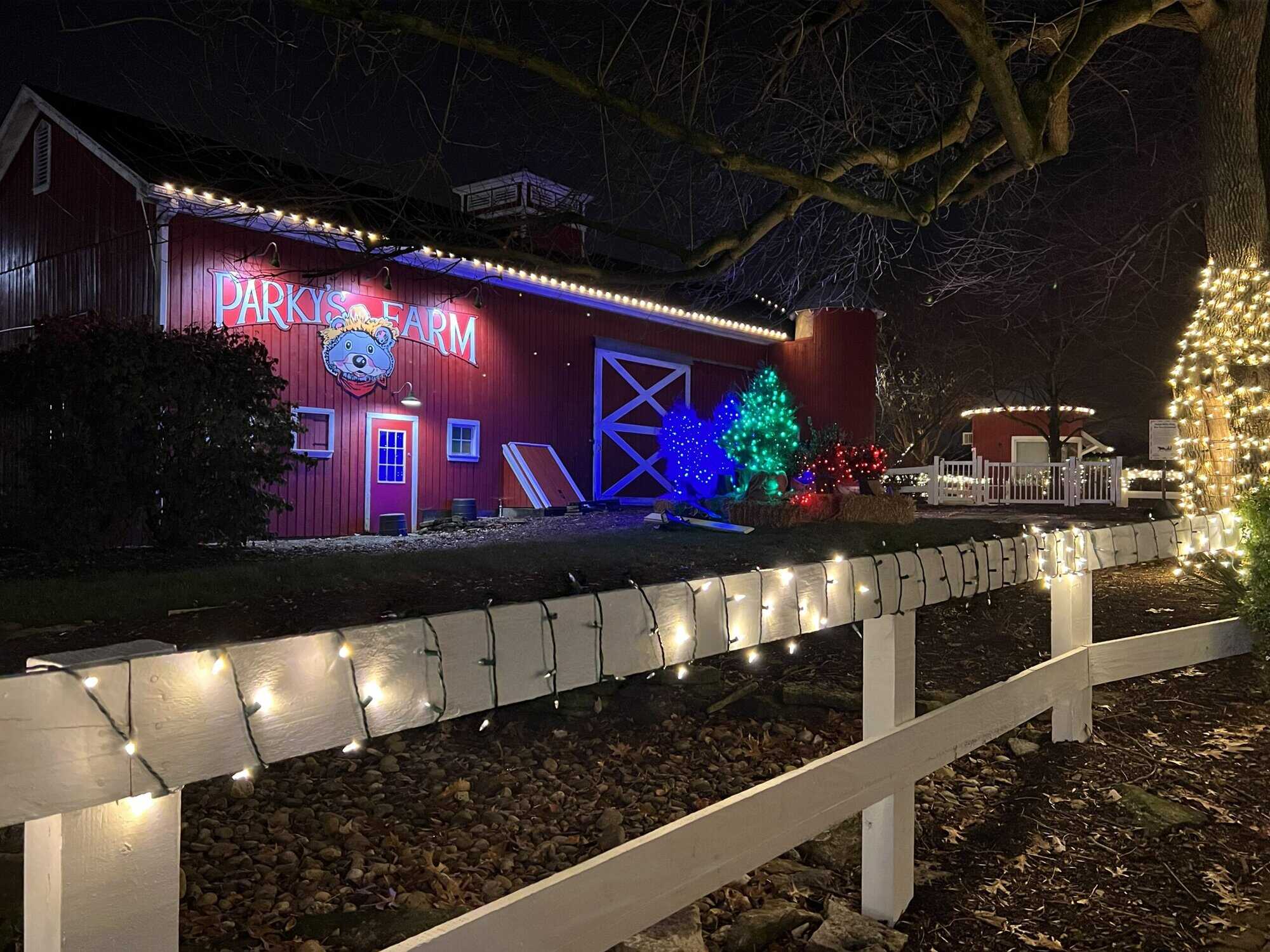 holiday lights on the fence and the barn at Parky's Farm